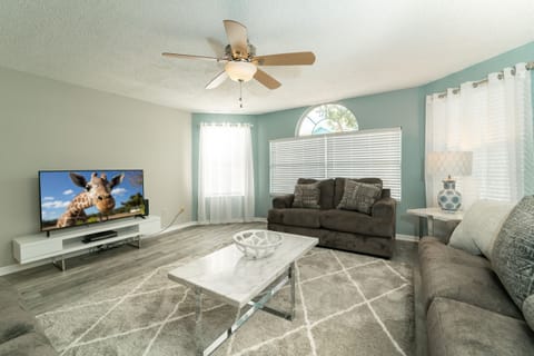 Spacious living room with flat panel TV and DVD