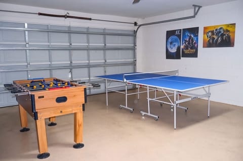 Games room showing foosball and ping pong table