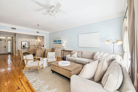 Sink into plush coastal comfort where soft blues and natural textures create your perfect retreat for relaxation and gathering.