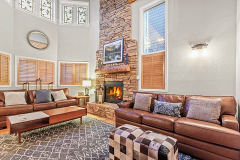 Unwind in this stunning living room with a cozy fireplace and seating.