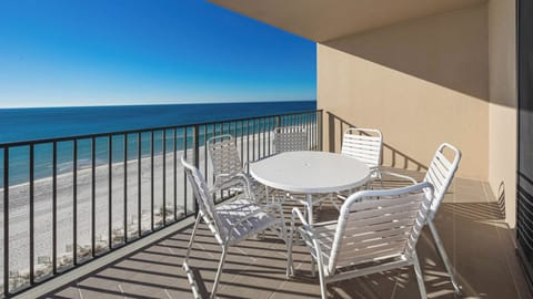 Enjoy meals or morning coffee at the round table surrounded by comfortable chairs, with expansive views of the beach