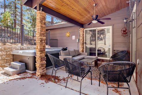 Private outdoor hot tub, surrounded by tall pines, perfect for relaxing under the trees after a day of adventure—enjoy peaceful forest views, fresh air, and a truly rejuvenating stay.