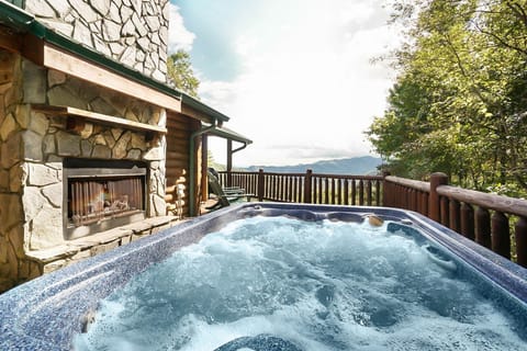 2019 main level hot tub deck and fireplace