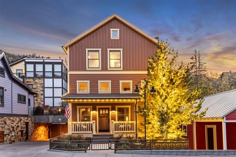 Stunning alpenglow on The Peak at Town Lift, a private home, decorated in timeless white holiday lights.