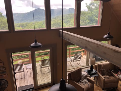 Gaze out over the mountain through the window wall in the living room