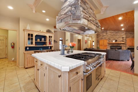 Fully equipped cabin kitchen with ample cabinetry, stove, fridge, microwave, and coffee maker—perfect for cooking meals, morning coffee, and feeling right at home on your stay.