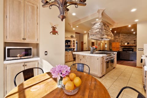 Fully equipped cabin kitchen with ample cabinetry, stove, fridge, microwave, and coffee maker—perfect for cooking meals, morning coffee, and feeling right at home on your stay.