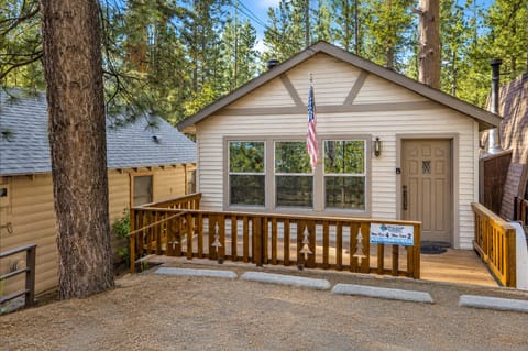 This charming mountain retreat features a spacious wooden front deck and private off-street parking. Tucked away under mature pines, the home offers a cozy and quiet atmosphere for your next getaway.