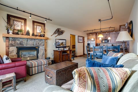Cozy up in your mountain retreat's inviting living room, where warm blankets and a crackling fireplace create the perfect après-ski atmosphere.