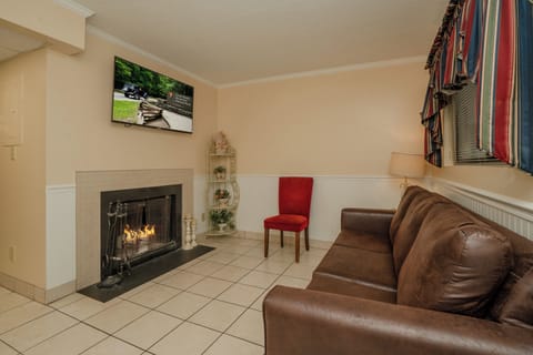 Unwind in your cozy living room where a crackling fireplace sets the perfect mood for relaxing evenings. Sink into comfortable seating and let the warmth embrace you after a day of mountain adventures.