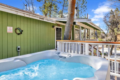 Private outdoor hot tub surrounded by tall pines, perfect for relaxing under the trees after a day of adventure—enjoy peaceful forest views, fresh air, and a truly rejuvenating stay.