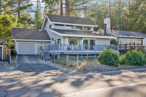 Private outdoor deck surrounded by tall pines, perfect for relaxing under the trees after a day of adventure—enjoy peaceful forest views, fresh air, and a truly rejuvenating stay.