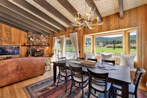 Cozy dining area with a large table, perfect for enjoying home-cooked meals, morning coffee, and relaxed moments together during your stay.