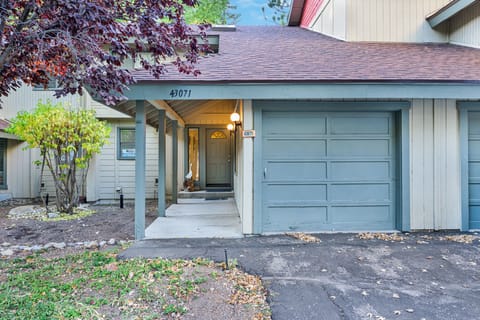 Welcoming cabin entry surrounded by towering pine trees, offering fresh mountain air and a peaceful forest setting—the perfect first impression for your Big Bear Lake getaway.