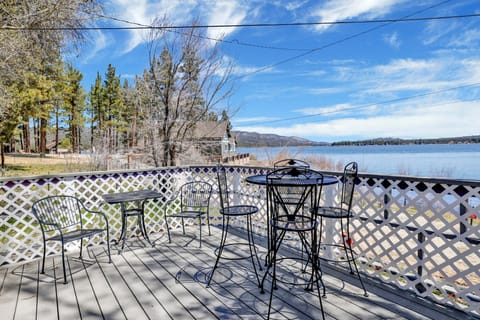 Private outdoor deck with comfortable seating and a BBQ, surrounded by tall pines, perfect for relaxing under the trees after a day of adventure—enjoy peaceful forest views, fresh air, and a truly rejuvenating stay.
