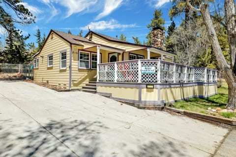 Welcoming cabin entry surrounded by towering pine trees, offering fresh mountain air and a peaceful forest setting—the perfect first impression for your Big Bear Lake getaway.