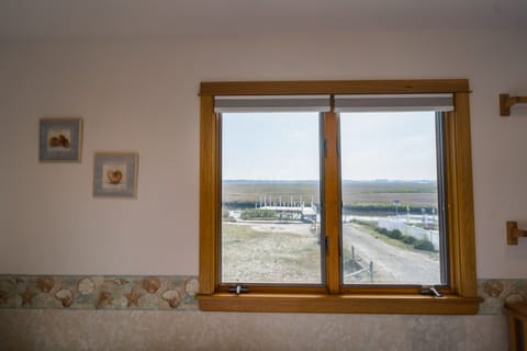 Bedroom 3: View of backyard, dock/deck, cement ramp, creek & refuge to the West.