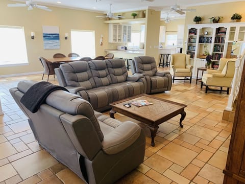 Great room area with family room, kitchen and large ocean view balcony.