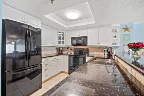 Updated kitchen w/ modern appliances.  Standard coffee pot, Keuriq, crockpot...