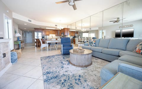 Unwind in the inviting living area, featuring comfortable seating and a stylish coffee table for relaxation and conversation