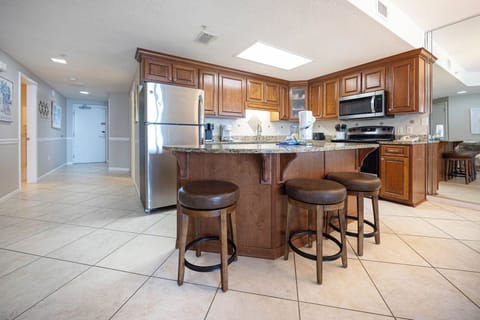 Gather around the stylish breakfast island, perfect for casual meals and conversations in this inviting kitchen space