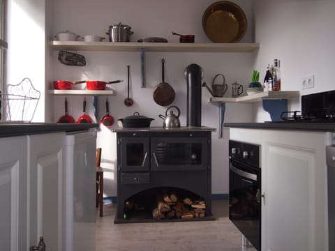 Kitchen with wood burning range