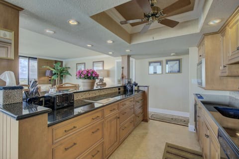 Fully stocked kitchenette with 2 burner stove, dishwasher, microwave, wine refrigerator and small pull out drawer refrigerator/freezer.  No oven.