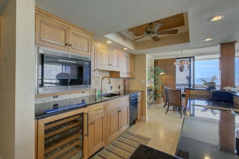 Fully stocked kitchenette with wine refrigerator and solid stone counters.  There is a small refrigerator/freezer only, two burner stove top without a