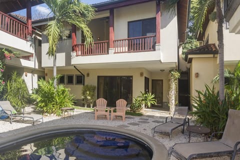 Pool view with condo entrance behind