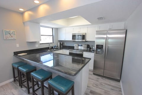 Newly Renovated Kitchen with Granite Countertops, New Stainless Steel Appliances, and Breakfast Area for 4