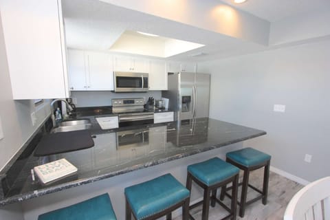 Newly Renovated Kitchen with Granite Countertops, New Stainless Steel Appliances, and Breakfast Area for 4