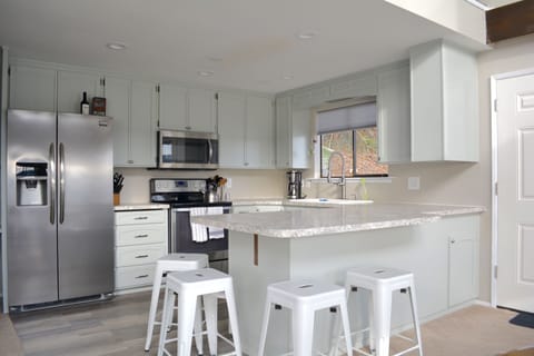 Fully stocked kitchen with counter seating