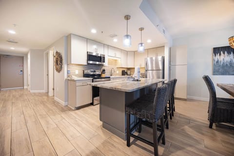 Enjoy cooking in this spacious kitchen with a large island, stainless appliances, and stylish seating for dining