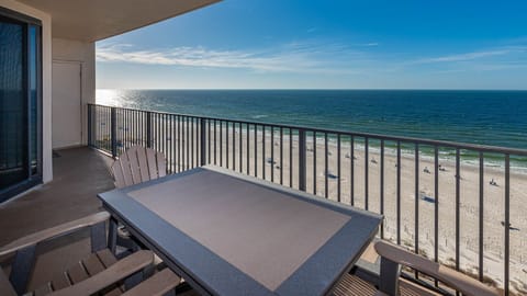 Savor the fresh air while seated at the outdoor table, enjoying views of the beach and tranquil waters