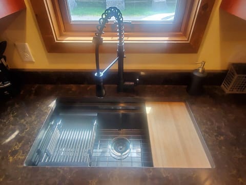 New Deep Sink with built in veggie washing and chopping board station.