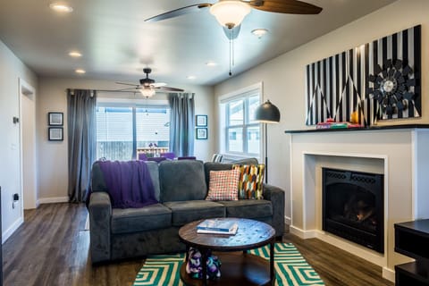 Relax by the gas fireplace in this fun living room