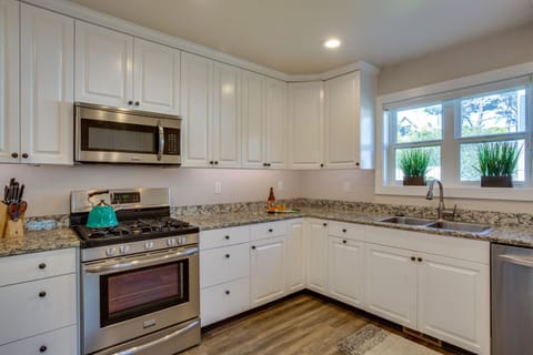 An amazing kitchen with custom cabinetry, counter-tops and double sinks.