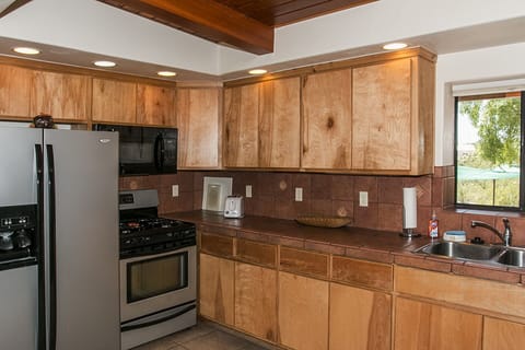 Kitchen with lots of lighting, big microwave, gas oven!  