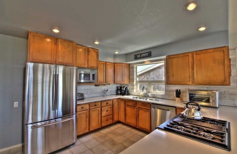 The finest in stainless steel appliances and lovely cabinetry, highlight this chef-worthy kitchen.