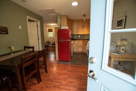 Entrance view of kitchen, bedroom on left and living room/sofa bed thru hallway.
