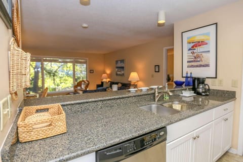 The open floor plan layout makes it very easy to interact with guests in the kitchen & living room areas.