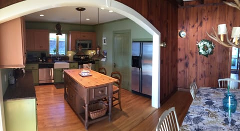 The kitchen from dining room with ocean views.