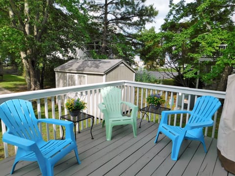 451 D Garfield Parkway - Teal Adirondack Deck - Raised wooden deck featuring teal and light green Adirondack-style lounge chairs.