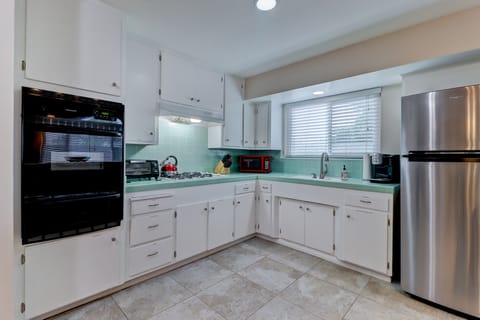 Microwave, toaster oven, pod coffee maker, dishes, cooking ware, utensils