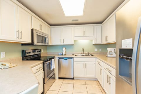 Cook your favorite meals in this functional kitchen with stainless steel appliances and ample counter space
