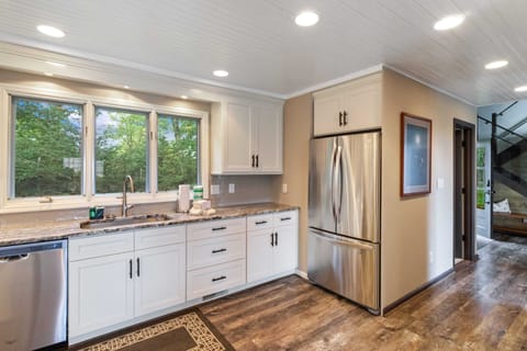 Kitchen boasts Granite Countertops, Stainless Under-mount Sink, and Stainless Appliances