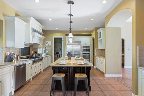 Sleek, modern kitchen with stainless steel appliances.