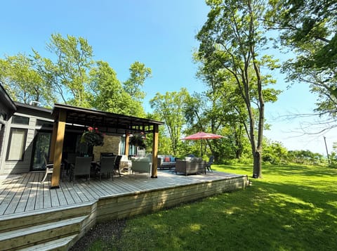 The wide sandy beach is only a few steps away from this inviting outdoor space. 