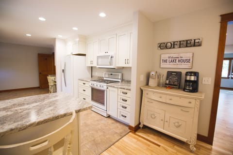 Kitchen. Electric stove . Keurig, drip coffee maker.