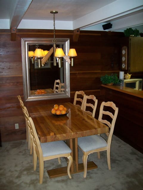 Dining area with kitchen to the right.